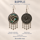 Teal Reverie design card showing Horsehair Embroidery, floral reverse, circular form and reversible wear, under Lines That Keep Us Connected.