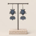 SAYRUE CURRENT earrings on display