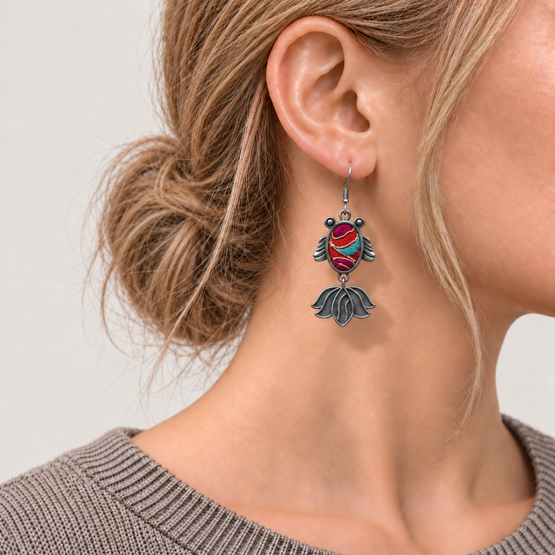 Scarlet Reverie handmade fish earrings, front worn